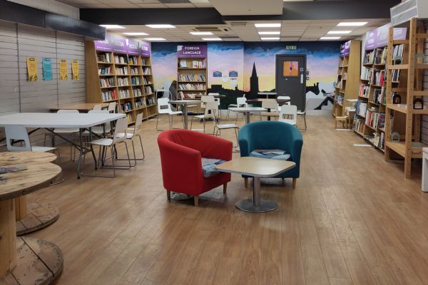Honesty Library with bookcases, community table and seating areas